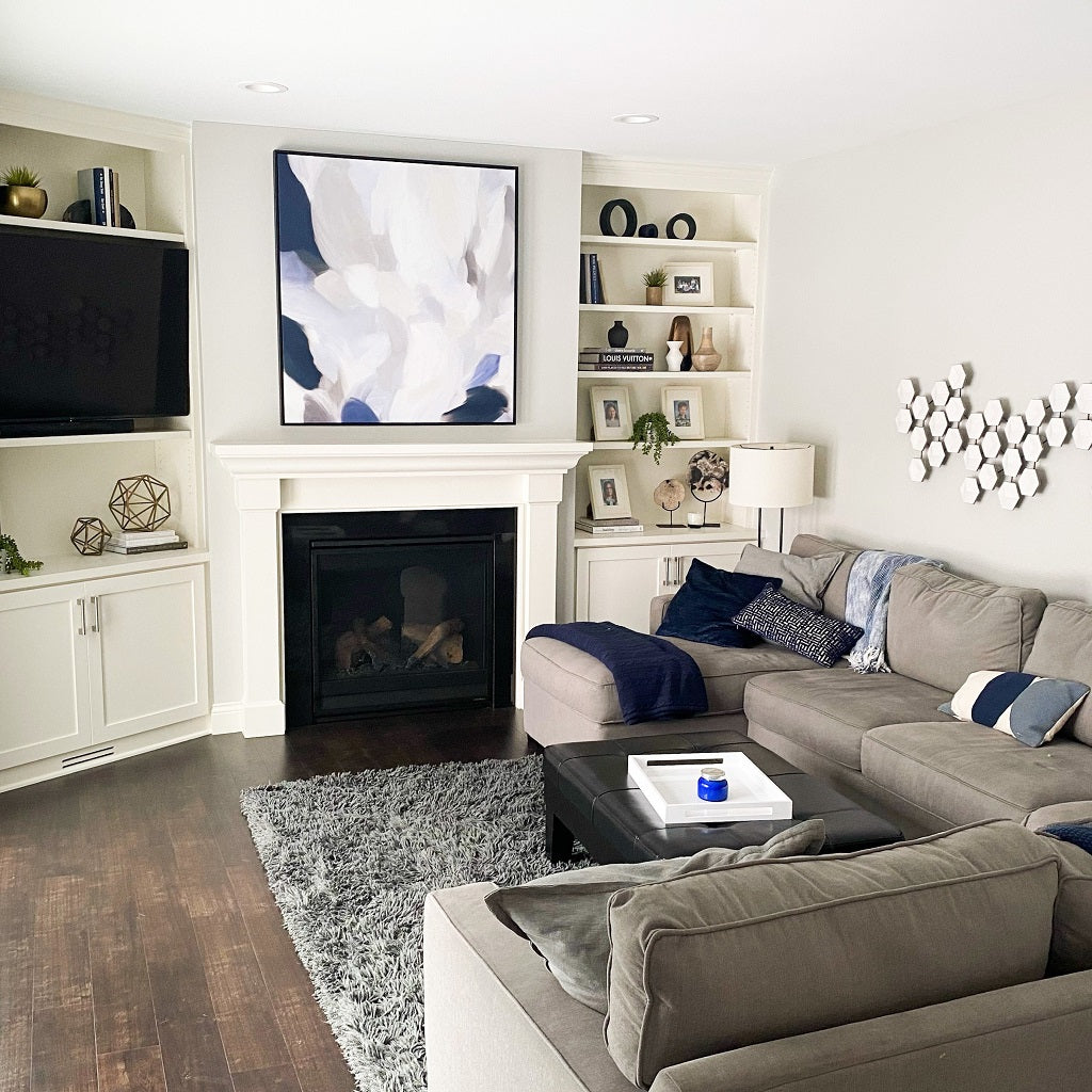 living room with beautiful new gas fireplace and custom cabinets