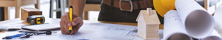 A contractor planning a fireplace installation