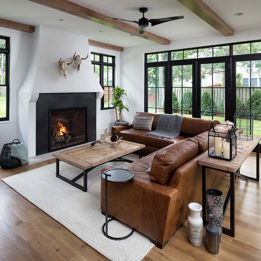 A western style home with a fireplace fixture in the family area
