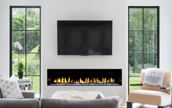 a modern gas fireplace in living room below tv